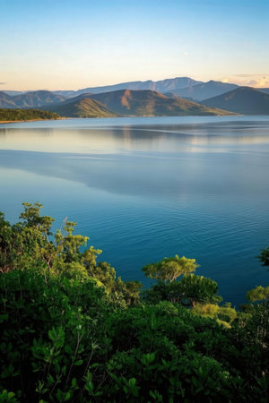Beautiful landscape of lake and mountains at sunset in the evening.の素材