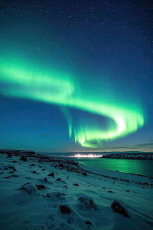 Aurora borealis, northern lights, over the sea in winterの素材