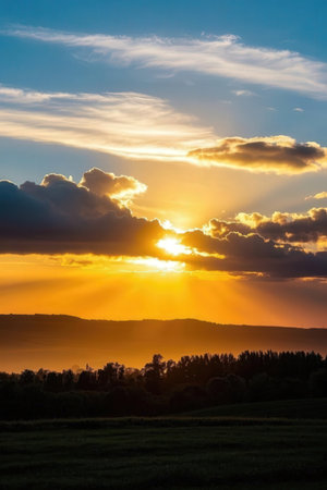 Sunset over the fields and forests in the countryside of Bavariaの素材