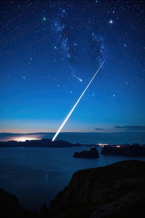 A comet in the night sky over the sea. Long exposure.の素材
