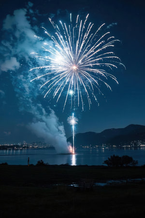 Colorful fireworks in the night sky over lake Garda, Italyの素材