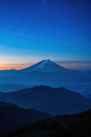 Man standing on top of a mountain and looking at the sunrise.の素材