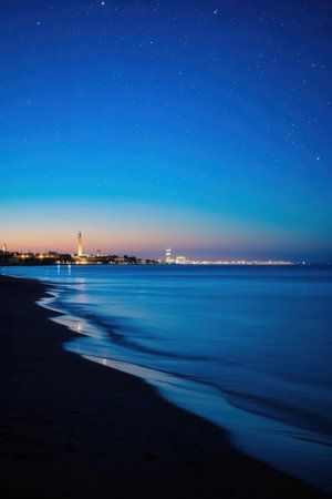View of the lighthouse on the beach at night. Sochi, Russiaの素材