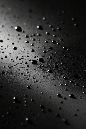 Drops of water on a black background. Shallow depth of field.の素材