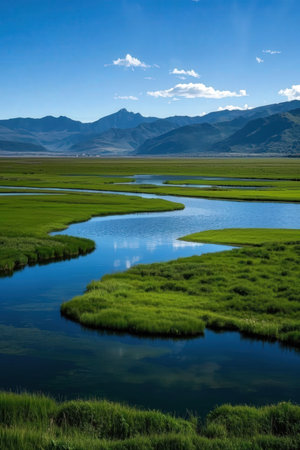 Mongolian grassland with lake and mountains in the backgroundの素材