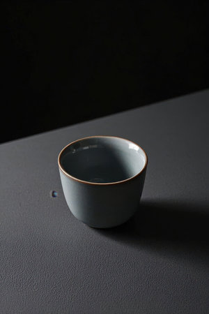 Ceramic tea set on a black background with a copy spaceの素材