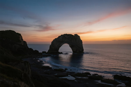 Durdle Door at sunset, Jurassic Coast, Dorset, UKの素材