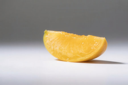 Slice of orange on a white background. Shallow depth of fieldの素材