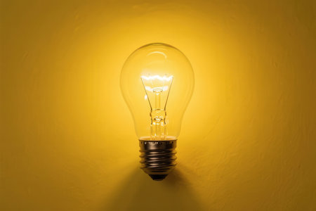 Light bulb on yellow background. Concept of idea, innovation and creativity.の素材