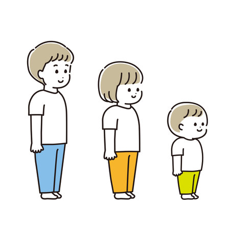 A set of children standing upright, about 7, 4 and 2 years old.のイラスト素材