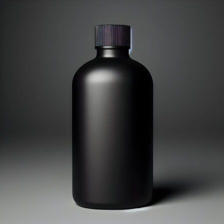 Mockup of a black plastic bottle on a gray background.の素材