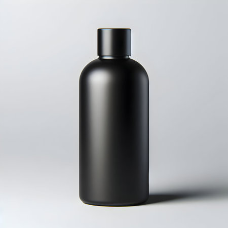 Blank black cosmetic bottle on a white background. 3d renderingの素材