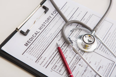 Medical stethoscope lying on cardiogram chart closeup. Medical help, prophylaxis, disease prevention or insurance concept. Cardiology care,health, protection and prevention. Healthy life conceptの写真素材