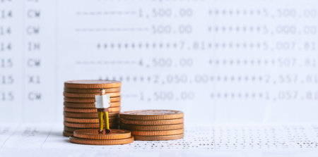 Miniature people: Businessman standing on bank passbook. retirement planning and pension. Money saving and Investment. Inequality and social class. Income and economic inequality concept.の写真素材