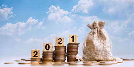 2021 and Coins stack. Pension fund, 401K, Passive income. Investment and retirement. Business investment growth concept. Risk management. Budget 2021.の写真素材