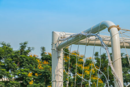 Goal corner of football or soccer with net sky and treesの写真素材