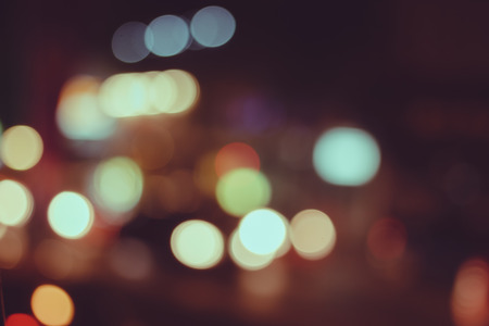Abstract bokeh vintage background from light on the roadの写真素材