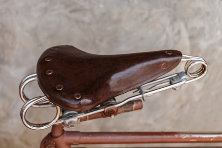 Leather saddle of vintage old bicycleの写真素材