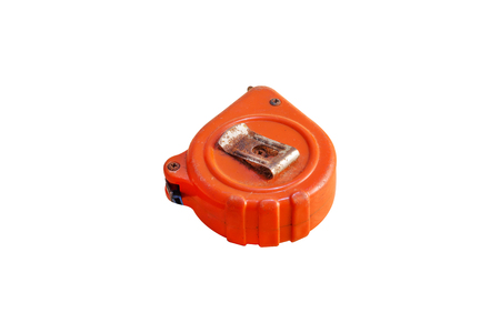 Old and rust dirty orange tape measure isolated on white backgroundの写真素材