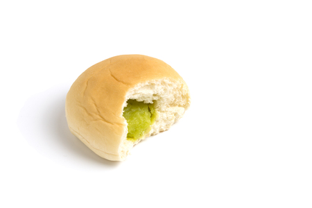 Green custard filling bun on white backgroundの写真素材