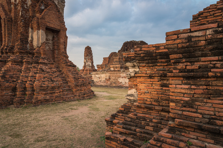 View of Wat Mahathat temple in cloudy day in Ayutthaya, Thailand.の写真素材