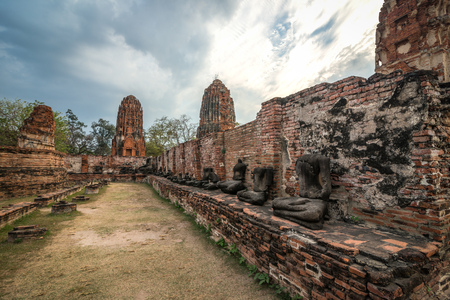 View of Wat Mahathat temple in cloudy day in Ayutthaya, Thailand.の写真素材