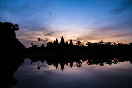View of the reflection of an Angkor Wat in silhouette look in Siem Reap, Cambodia.の写真素材