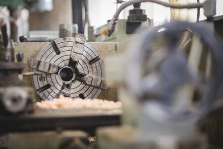 The sample holder part of the retro Lathe machine in the workshop.の写真素材