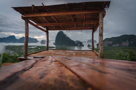 The scenery of the Sametnangshe island looks through the wooden shack in Phang-nga province, Thailand.の写真素材