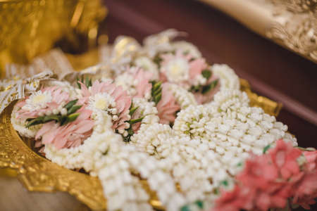 Jasmine garland in Phan Thong (golden tray) used for a Thai wedding ceremony.の写真素材