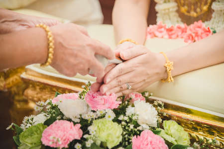 Watering the conch shell in a Thai wedding ceremony.の写真素材