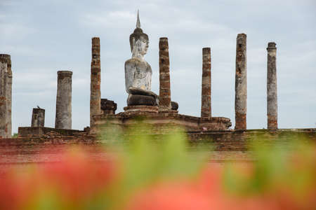 The scenery of Wat Mahathat temple on a cloudy day in the rainy season at Sukhothai province, Thailand.の写真素材