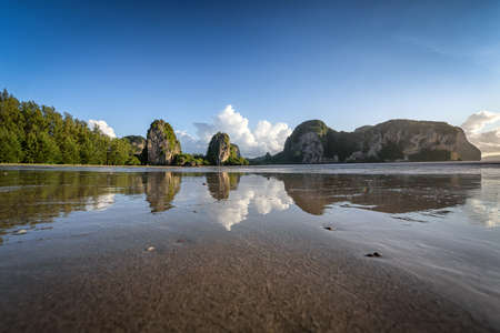The beautiful scenery of the Rajamangala beach with the reflection on a clear blue sky day at Trang province, Thailand.の写真素材