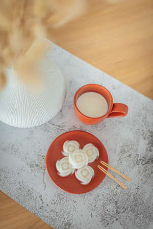 A set of coconut milk jelly desserts with a cup of milk on the table. (selective focus)の写真素材