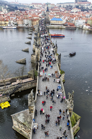 Tourists walk along the Charles Bridgeのeditorial素材