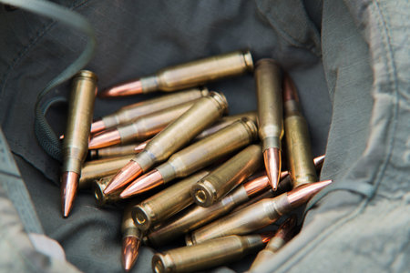 bunch of bullets lying in a military hat