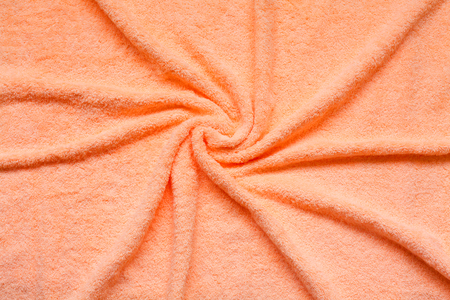soft pink texture of bath towel folded as a background. Soft terry towel on light background, top viewの写真素材