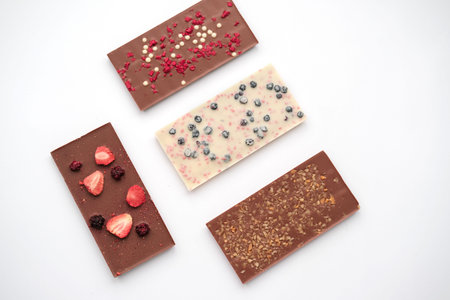 Handmade milk and white chocolate bars with a variety of dried fruit toppings