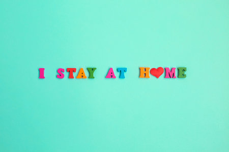 I Stay at Home phrase on blue background. Stay safe, stay inside home. Save planet from corona...