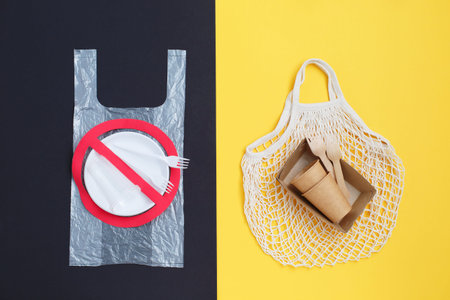 Stop sign on a plastic dishes. The transition to the use of ecological utensils. Ecological concept.