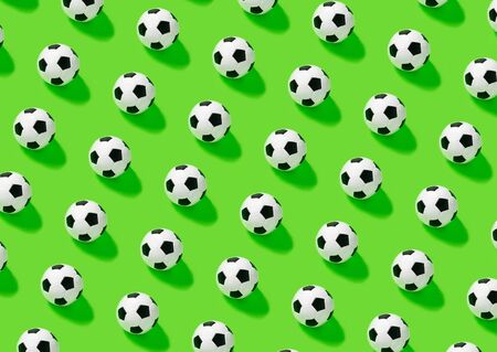 Pattern. Soccer ball on green backgraund. place for text. Game, match hobbyの写真素材