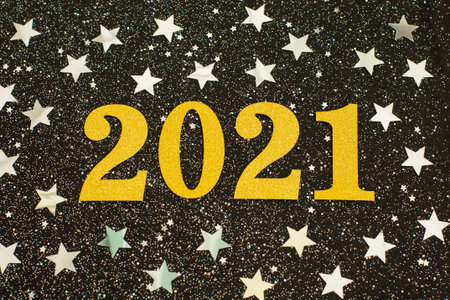 Gold numbers 2021 on silver stars background. New year's holiday concept, Happy New year 2021.