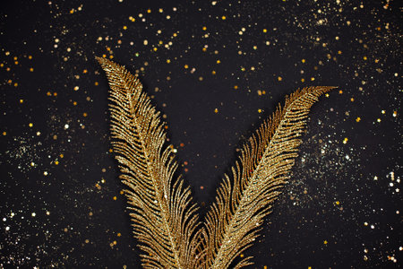 Golden leaves design elements on black background. Decoration elements for greeting cards. Place for text. Festive concept.の写真素材