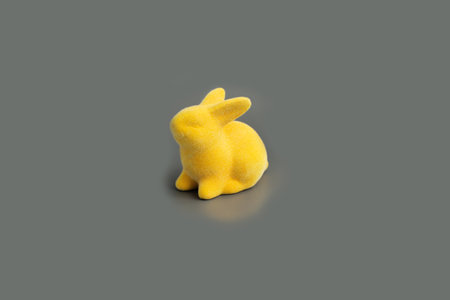 Happy Easter mockup. yellow Easter bunny on gray background. flat lay. Illuminating Yellow and Gray Color of the year 2021. Easter concept. Copy spaceの写真素材