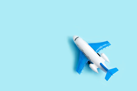 Toy airplane on a blue pastel background. Model plane.