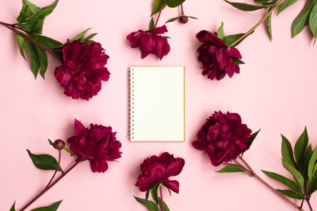 Peony flowers and Empty notebook for planning or wishingの写真素材