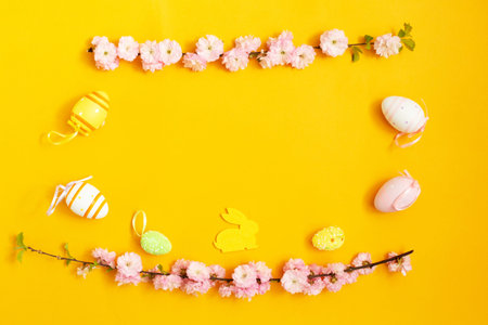 Color easter eggs, easter bunny and sprig of magnolia onの写真素材