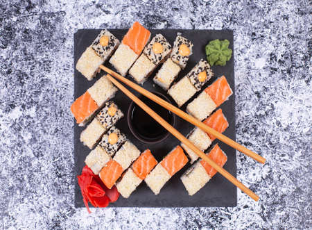 Sushi set on black stone plate. Japanese sushi food.の写真素材