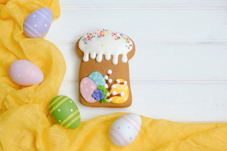 Easter with colorful eggs and traditional cakes over white wooden table.の写真素材
