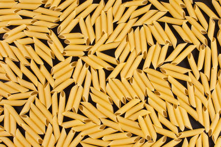 Italian Macaroni Pasta Penne Rigate raw food backgroundの写真素材